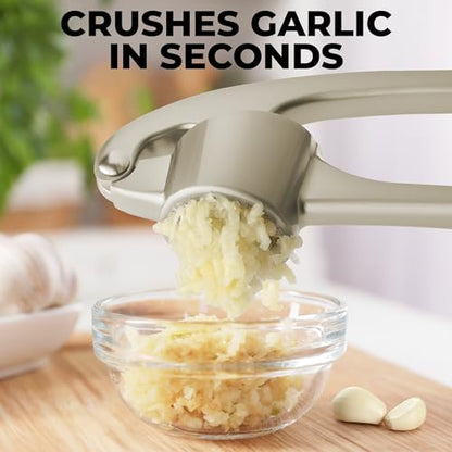 Zulay Kitchen Premium Garlic Press Set - Rust Proof & Dishwasher Safe Professional Garlic Mincer Tool - Easy-Squeeze, Easy-Clean with Soft, Ergonomic Handle - Silicone Garlic Peeler & Brush (Chrome)