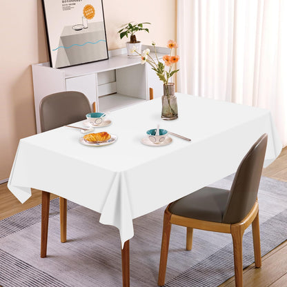 Skiennix Disposable White Plastic Tablecloths - 40 Pack, 54"x108" Rectangle Covers for Parties