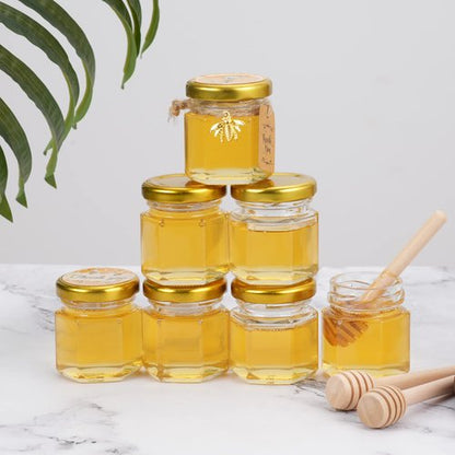 JIUHSHN 60Pcs Mini Glass Honey Jars 1.5Oz Hexagon Small Honey Jars In Bulk with Wooden Dippers,Bee Charms,Thank You Cards,Jutes and Stickers for Baby Shower Wedding Party Favors