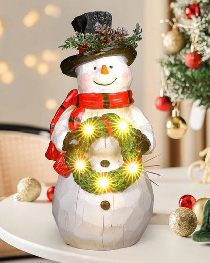 iStatue Light-Up Snowman Figurine - Charming 9.25'' Resin Snowman with Wreath & LED Lights for Winter Decor
