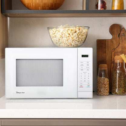 Regine Switzerland 1.1 Cu. Ft. Countertop Microwave Oven - Sleek White Design for Modern Kitchens
