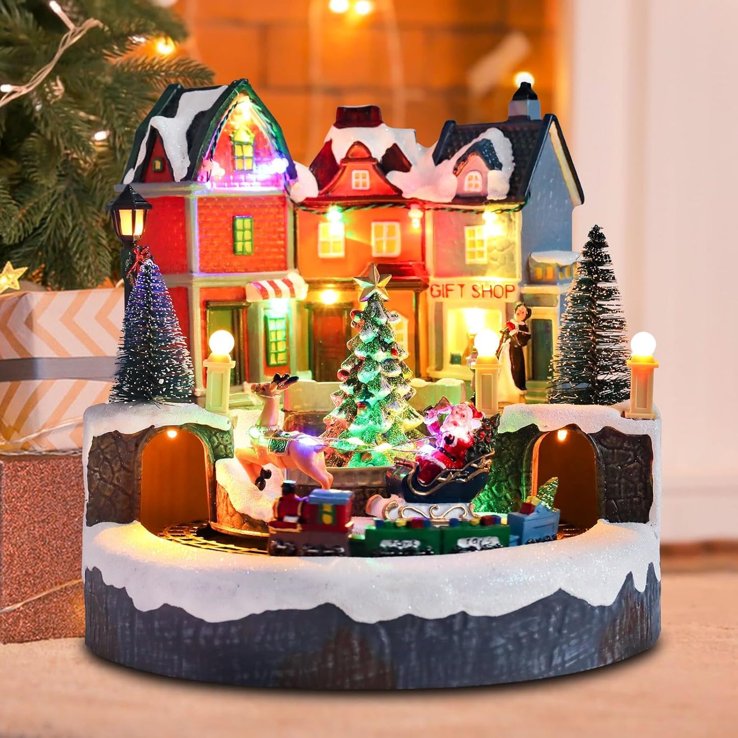 Afirst Christmas Village Houses - Lighted Collectible Figurines with Moving Train & Santa Sleigh | Musical Indoor Display